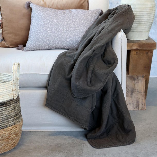 quilt plaid p� sofa i stue