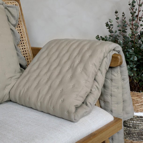 Quilt i latte p� stol