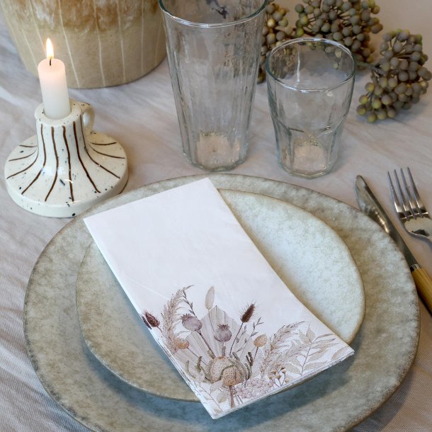 Serviet med gr�ftekantsblomster i bordd�kning