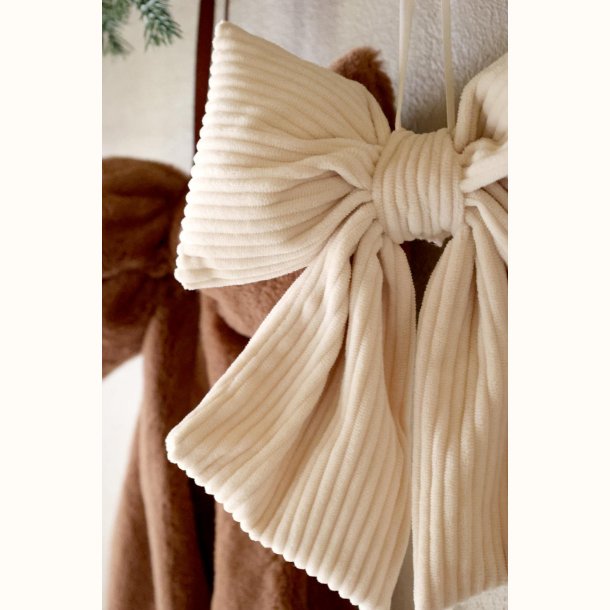 Beige julesl�jfe med ribbet fl�jl og lange b�nd