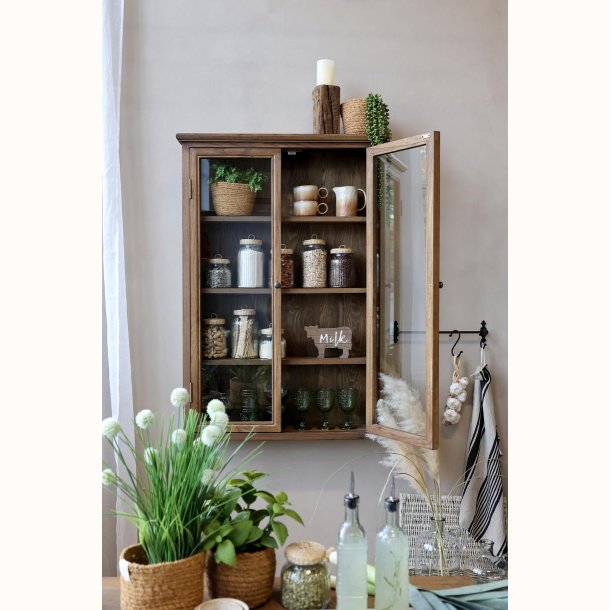 Opbevaringsglas med fletl�g i vitrineskab med boligindretning